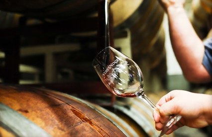 Pouring wine from barrel