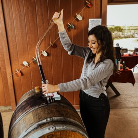 Nathalie Gaebe extracting wine from barrel