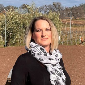 Stacy Billesbach in the vineyard