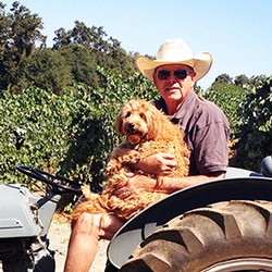 Poe helping on a tractor