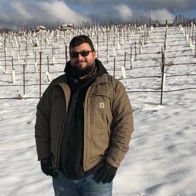 Patrik AJ Brown in the snowy vineyard